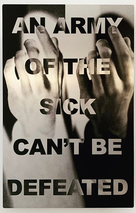 The whole image is in variants of greyscale, reminiscent of x-ray or other scans. bisecting the frame there are two images of the same back of the hand posed with most of the fingers curled inwards, with the pointer finger fully raised. Overlaid on the image is text that reads An Army Of The Sick Can’t Be Defeated.